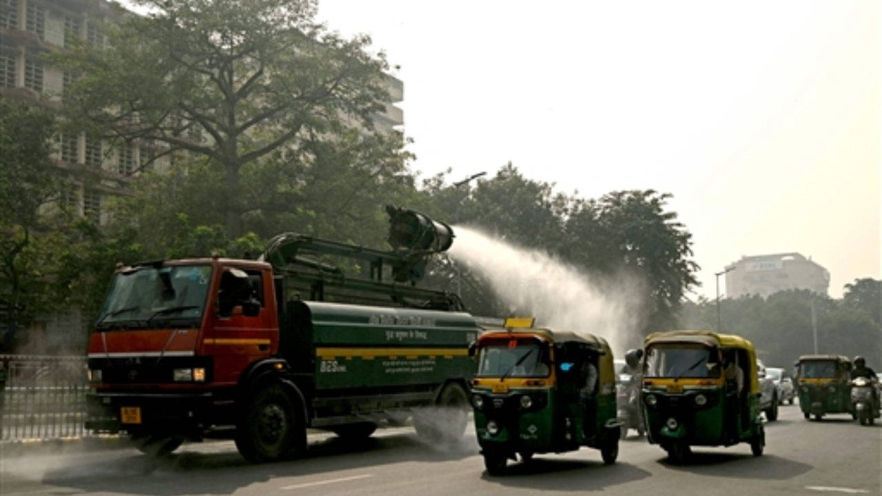 A vehicle of the Public Works Department (PWD) sprays water using an anti-smog gun to curb air pollution amid smoggy conditions in New Delhi