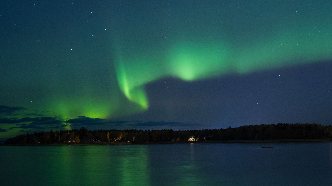 The Northern lights are seen in the sky in high-latitude regions, and are caused by magnetic storms due to solar activity.